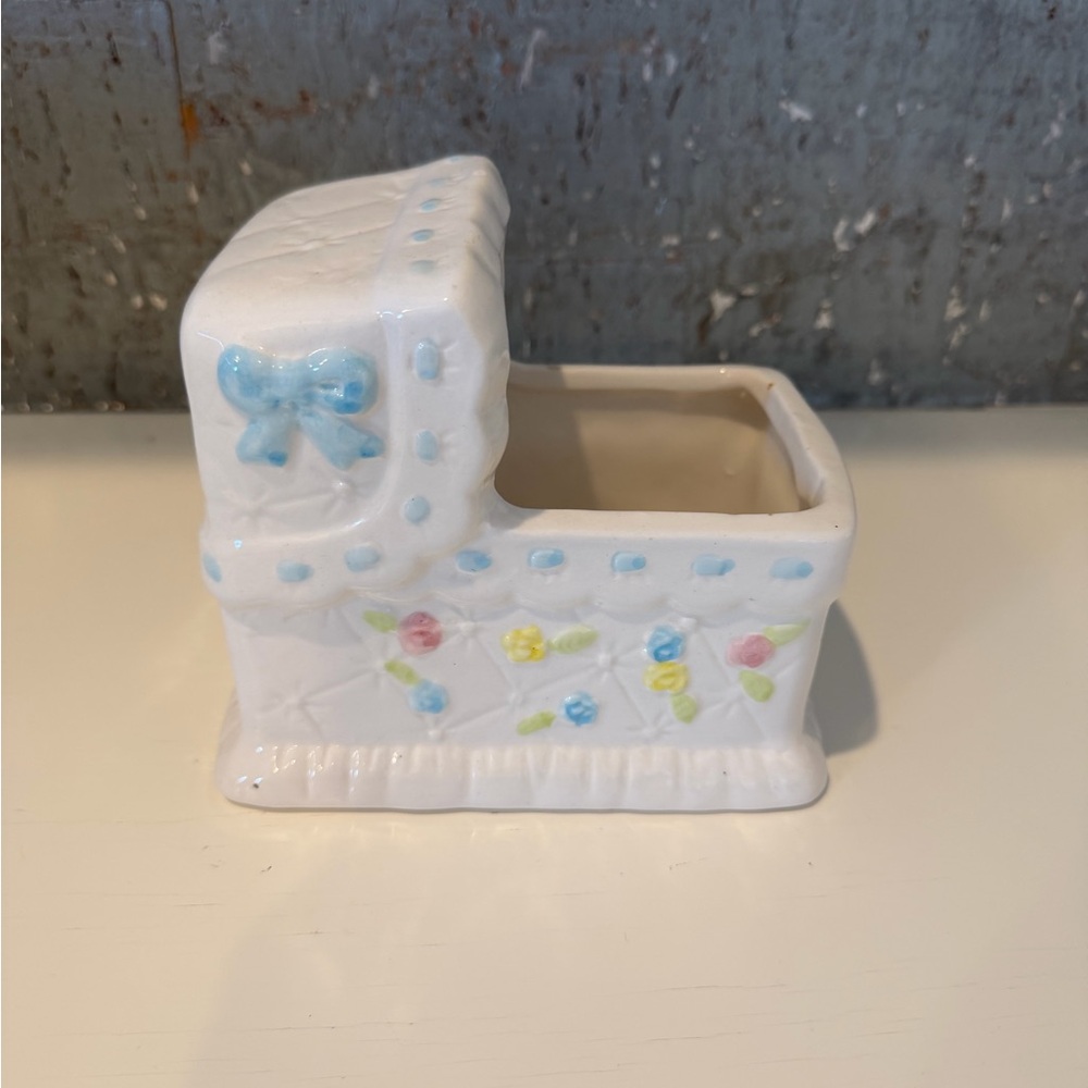 White Ceramic Baby Cradle with Pastel Accents